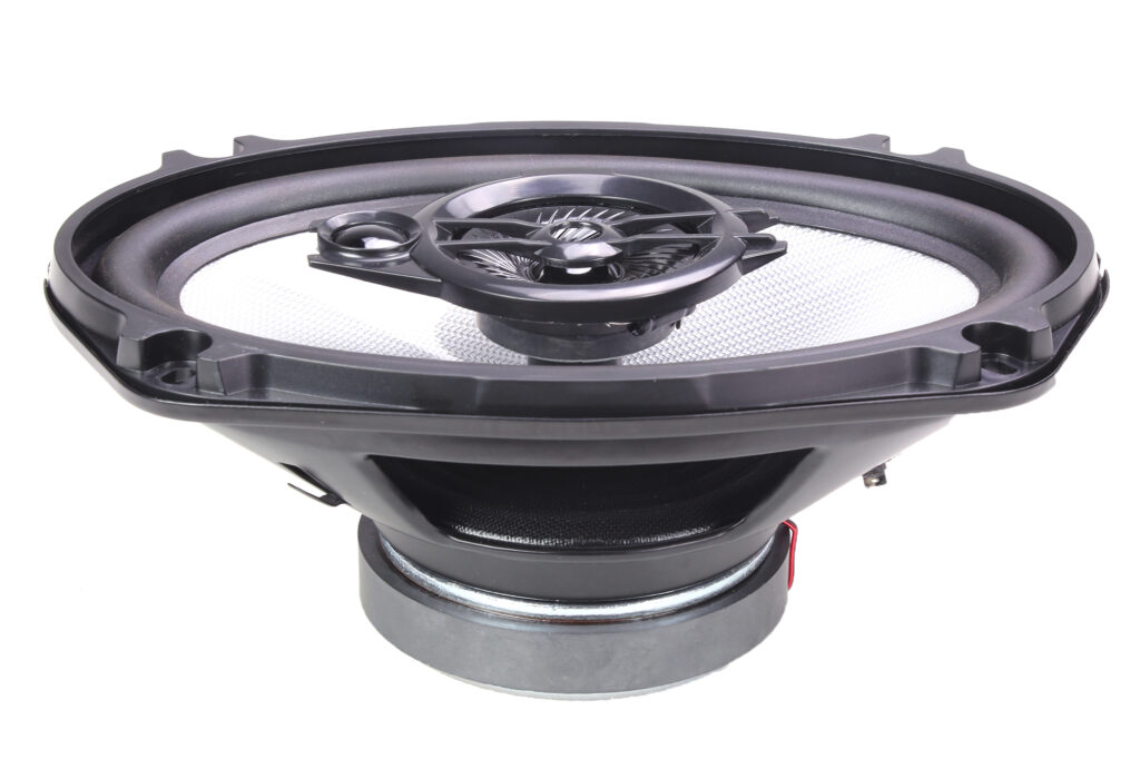 Angled view of CMC69G1 6x9-inch coaxial car speaker featuring 60W RMS, 1” woofer voice coil, 0.75” tweeter, wide 40Hz–20kHz frequency response, and 89.8dB sensitivity.